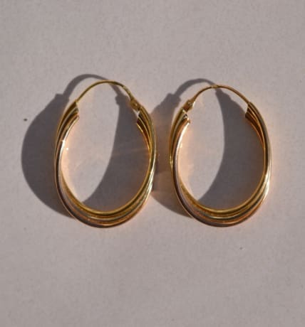 Paire de créoles ovales en Or jaune, Or blanc et Or rose 18 carats style Trinity